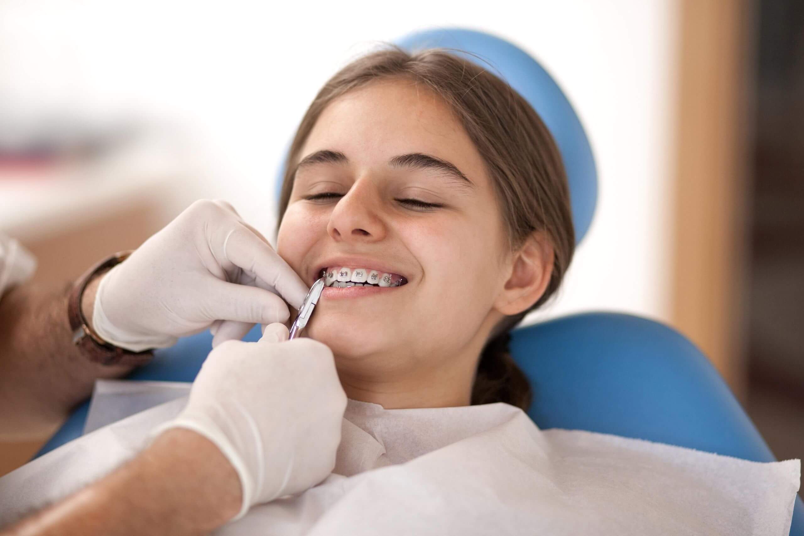 Young teenager getting fixed braces