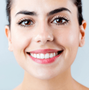 Brown eyed woman with straight white teeth smiling