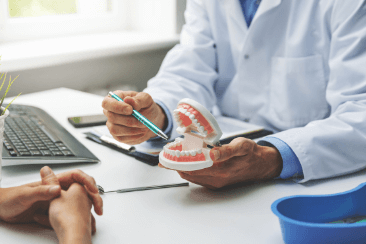 A dentist during a dental Implants consultation in Bolton