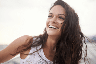 Brunette women with white teeth smiling