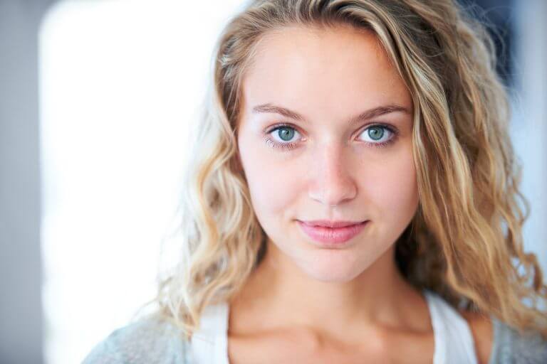 Blonde women looking into camera