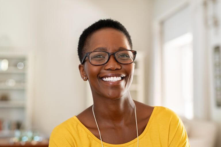 Women wearing glasses smiling