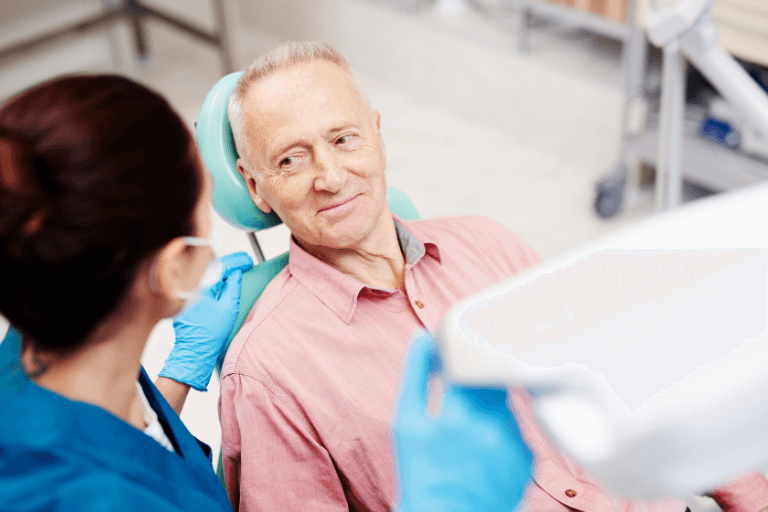 A man at the dentist getting dental implants at Bolton, Harwood