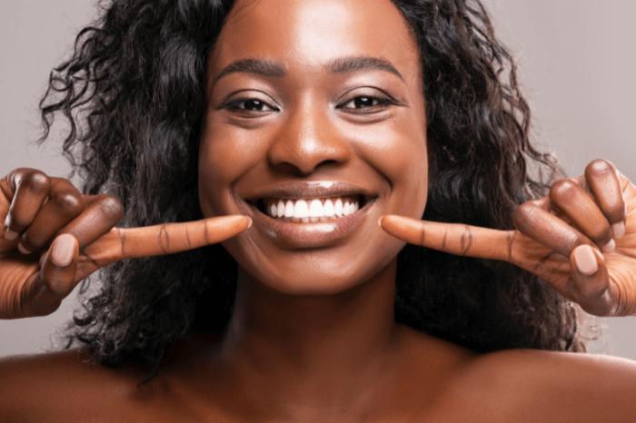 Woman pointing at braces at Harwood Dental Care in Bolton