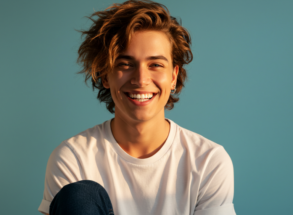 Person smiling after exploring orthodontic services at Harwood