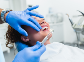 woman receiving a standard check up at harwood dental care