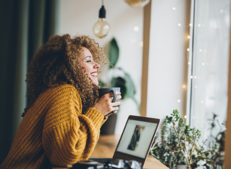 woman smiling in coffee shop during invisalign treatment at harwood dental care