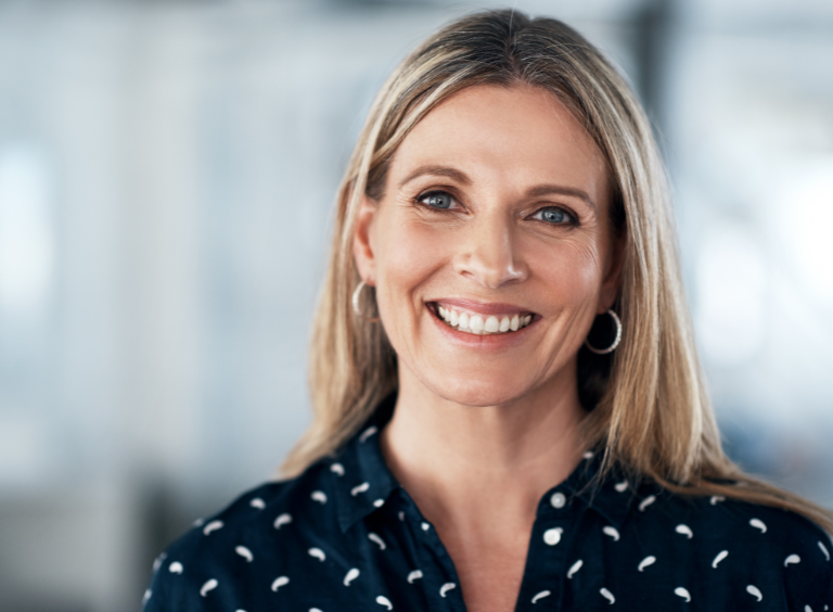 woman smiling after having tooth implant at harwood dental practice